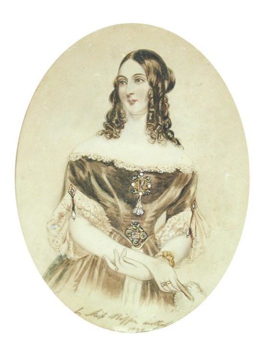 sepia toned portrait of Ada Lovelace with long ringlets and a Victorian era gown