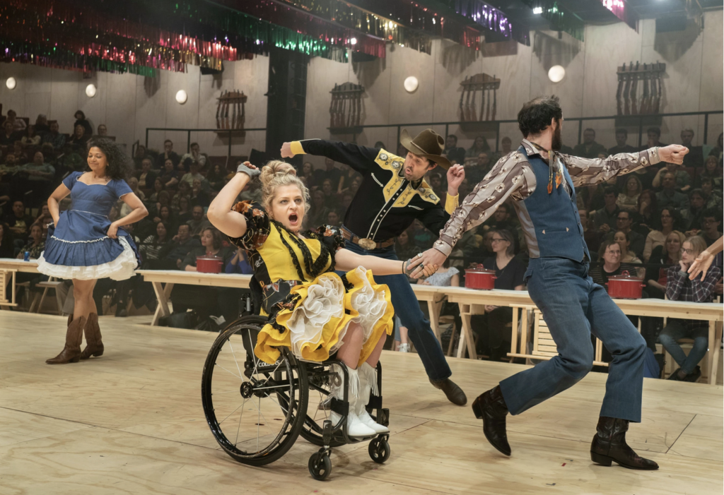 a woman dancing in a wheelchair